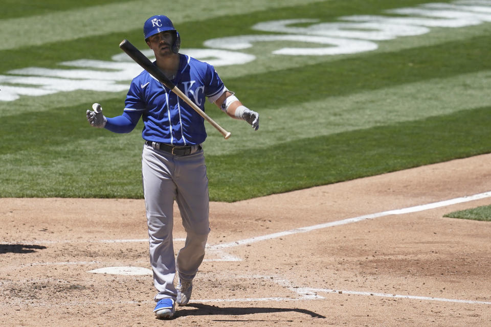 Kansas City Royals' Whit Merrifield walks to the dugout after striking out against the Oakland Athletics during the third inning of a baseball game in Oakland, Calif., Saturday, June 12, 2021. (AP Photo/Jeff Chiu)