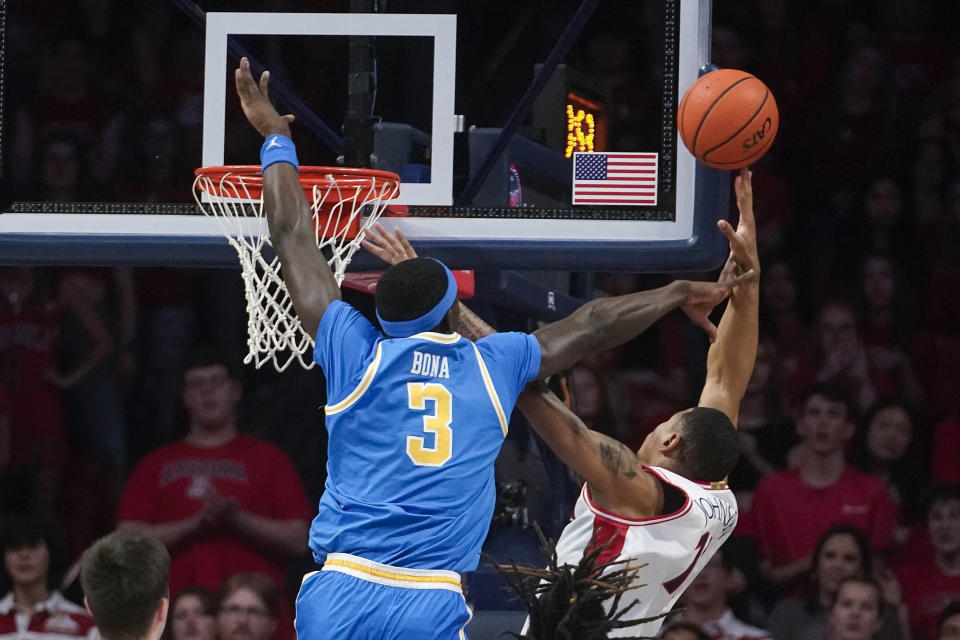 UCLA's Adem Bona (3) attempts to block a shot by Arizona's Keshad Johnson, right, during the first half of an NCAA college basketball game Saturday, Jan. 20, 2024, in Tucson, Ariz. (AP Photo/Darryl Webb)