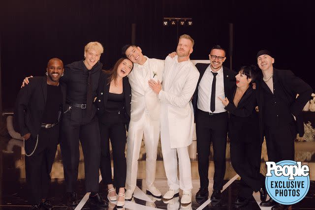 <p>HEATHER KINCAID PHOTOGRAPHER</p> Scott Hoying and Mark Manio celebrate their wedding with friends.