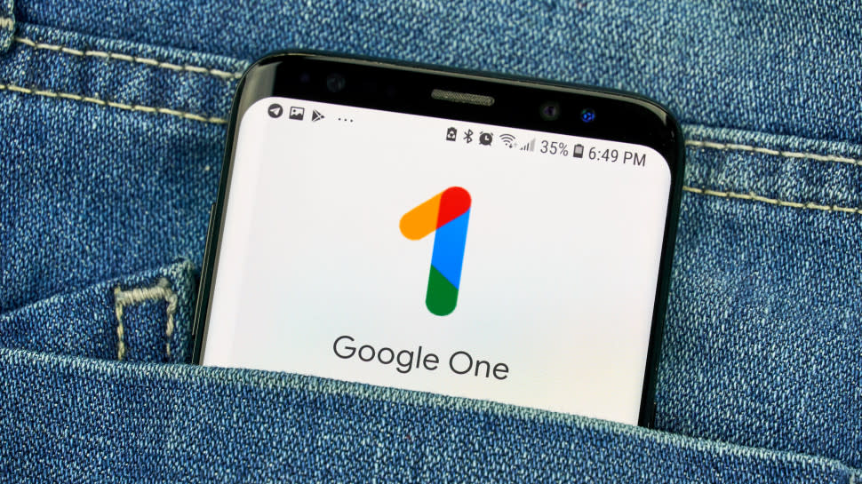  Google One app on a phone in a jeans pocket. 