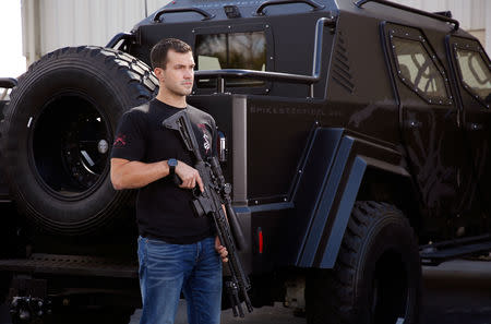 Nick Gough poses with a fully assembled .308 Roadhouse precision rifle at Spike's Tactical LLC, a gunmaker in Apopka, Florida, U.S. December 10, 2018. Picture taken December 10, 2018. REUTERS/Gregg Newton