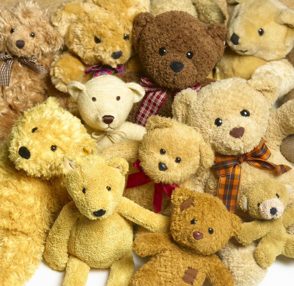 A collection of various teddy bears clustered together