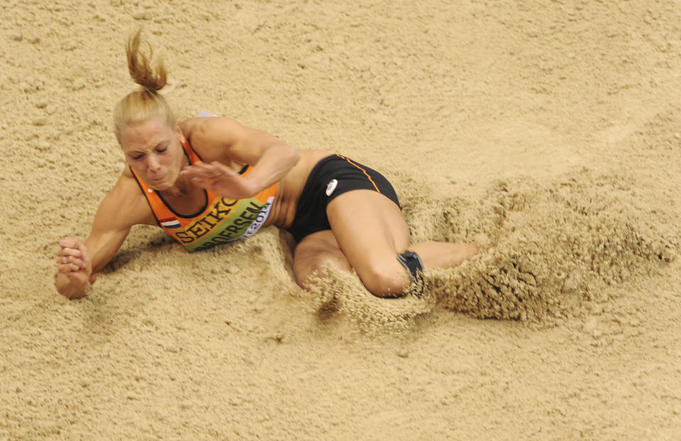 Netherlands' Nadine Broersen makes an attempt in the long jump of the women's pentathlon during the Athletics Indoor World Championships in Sopot, Poland, Friday, March 7, 2014. (AP Photo/Alik Keplicz)