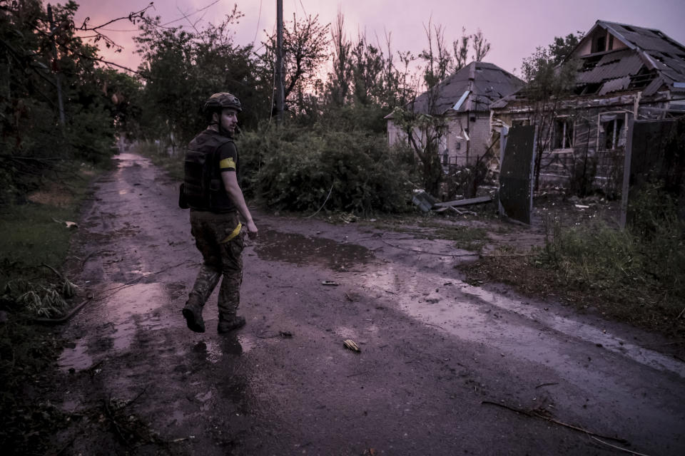 In this photo provided by the 24th Mechanised brigade press service, a Ukrainian soldier approaches his position on the front line at Chasiv Yar in Donetsk region, Ukraine, Friday, June 21, 2024. (Oleg Petrasiuk/Ukrainian 24 Mechanised brigade via AP)