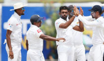 Cricket - Sri Lanka v South Africa - First Test Match - Galle, Sri Lanka - July 14, 2018 - Sri Lanka's Dilruwan Perera (L) celebrates with team mates after taking the wicket of South Africa's Hashim Amla (not pictured). REUTERS/Dinuka Liyanawatte