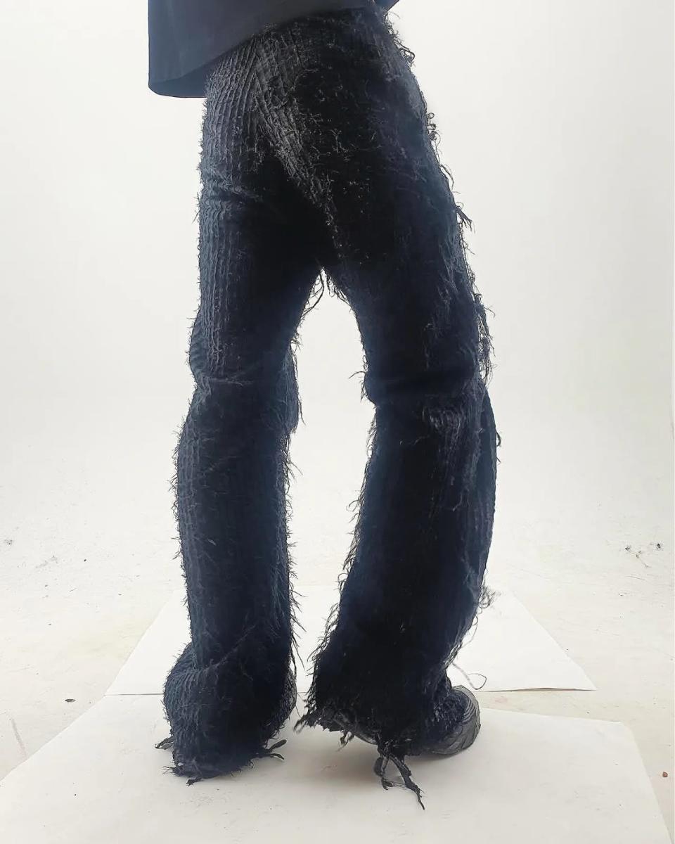 Slashed wool trousers made by Kai Ghattaura.