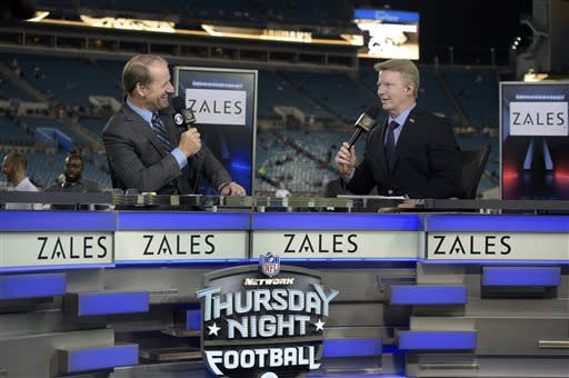 Phil Simms may not have a clear role with CBS' football crew next season, but the Frisco Roughriders are ready to bring him into their booth. (AP Photo/Phelan M. Ebenhack, File)