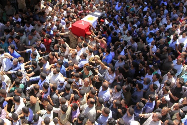 Egyptians carry the coffin of First Lieutenant Mohamed Ashraf, killed in clashes with Islamic State group jihadists in the Sinai, during his funeral in Ashmoun in the Nile delta on June 2, 2015