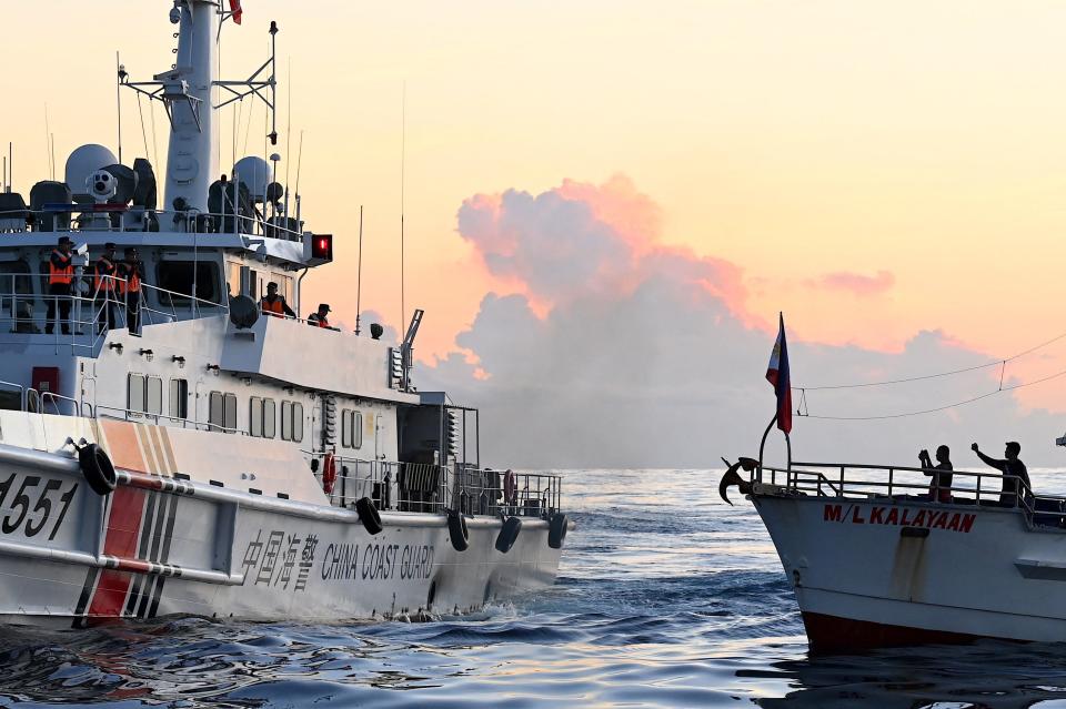 An image of a large Chinese Coast Guard ship perpendicular to a smaller Philippine resupply ship.