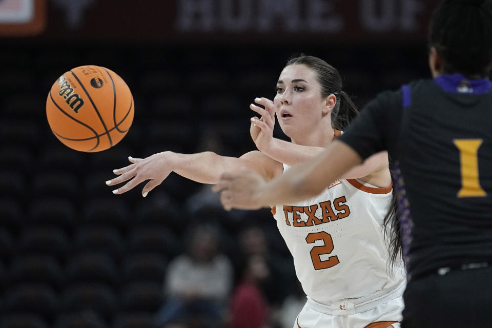 Texas guard Shaylee Gonzales (2) pass the ball past East Carolina guard Micah Dennis (1) during the second half of a first-round college basketball game in the NCAA Tournament in Austin, Texas, Saturday, March 18, 2023. (AP Photo/Eric Gay)