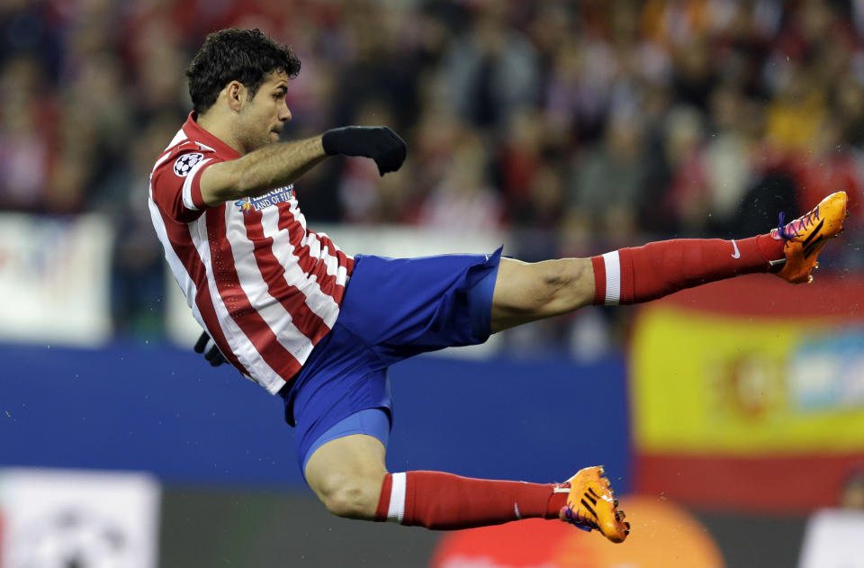 Atletico's Diego Costa scores the opening goal during a Champions League, round of 16, second leg, soccer match between Atletico Madrid and AC Milan at the Vicente Calderon stadium in Madrid, Tuesday March 11, 2014. (AP Photo/Paul White)