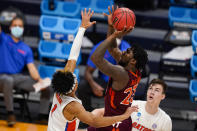 Virginia Tech guard Tyrece Radford (23) shoots over Florida guard Tre Mann (1) in the first half of a first round game in the NCAA men's college basketball tournament at Hinkle Fieldhouse in Indianapolis, Friday, March 19, 2021. (AP Photo/Michael Conroy)