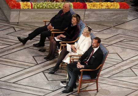 Norway's King Harald, his wife Queen Sonja, Crown Princess Mette-Marit and Crown Prince Haakon (L-R) attend the Nobel Peace Prize awards ceremony at the City Hall in Oslo December 10, 2014. REUTERS/Suzanne Plunkett