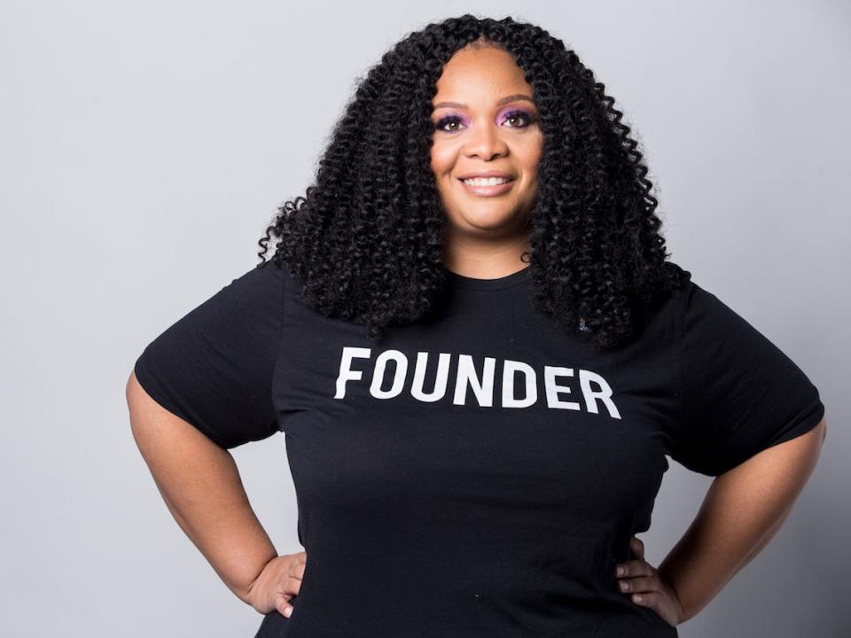 Kimberly Wilson stands wearing a black shirt with the word Founder written on it