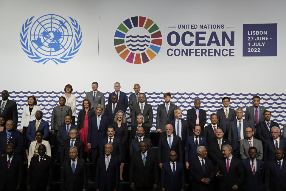 United Nations Secretary-General Antonio Guterres, Portuguese President Marcelo Rebelo de Sousa, and Kenya President Uhuru Kenyatta, center of front row, take part in a group photo at the United Nations Ocean Conference in Lisbon, Monday, June 27, 2022. From June 27 to July 1, the United Nations is holding its Oceans Conference in Lisbon expecting to bring fresh momentum for efforts to find an international agreement on protecting the world's oceans. (AP Photo/Armando Franca)