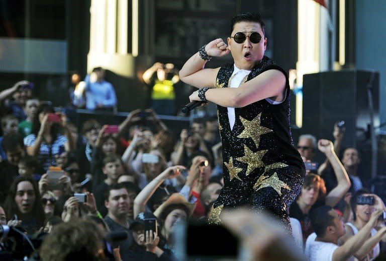 South Korean pop sensation Psy, whose real name is Park Jae-Sang, performs for fans at a promotion by the Sunrise breakfast television show in Sydney, on October 17, 2012. Psy's "Gangnam Style" became the first video to hit a billion views on YouTube on Friday, marking a fresh milestone in the global craze for the South Korean rapper and his horse-riding dance