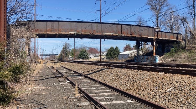 The Edgely bridge in Bristol Township, also called the Randall Avenue bridge, is closed to traffic after a second train was struck by concrete that came loose from the underside.