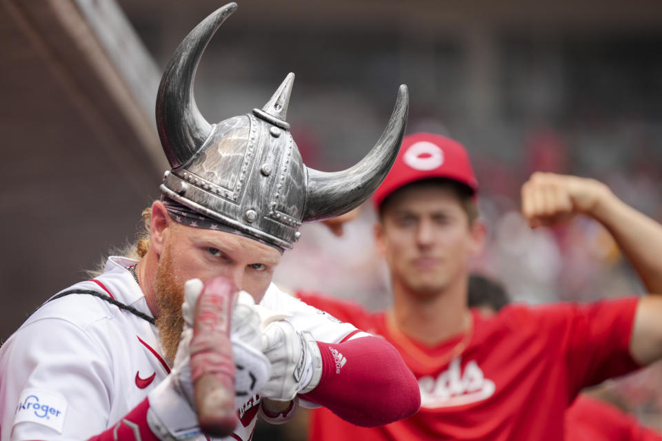 Cincinnati Reds' Jake Fraley celebrates in the dugout after hitting a two-run home run during the third inning of a baseball game against the Milwaukee Brewers in Cincinnati, Sunday, July 16, 2023. (AP Photo/Aaron Doster)