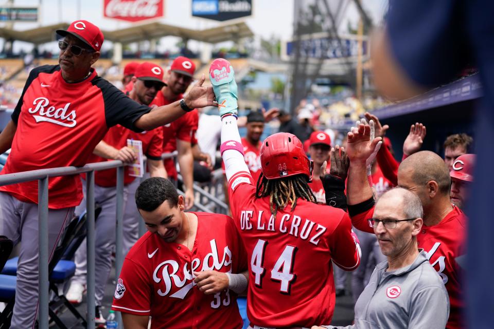 Cincinnati Reds' Elly De La Cruz (44) celebrates in the dugout after scoring off a double by TJ Friedl during the second inning of a baseball game against the Los Angeles Dodgers in Los Angeles, Sunday, July 30, 2023.