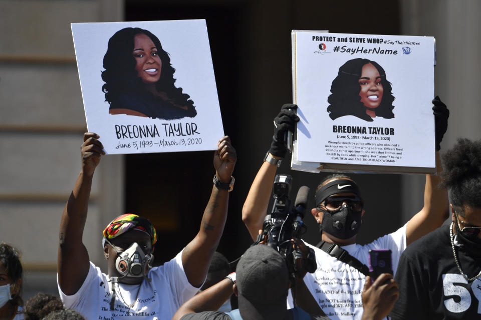 Signs are held up showing Breonna Taylor during a rally in her honor on the steps of the Kentucky State Capitol in Frankfort, Ky., Thursday, June 25, 2020. The rally was held to demand justice in the death of Taylor who was killed in her apartment by members of the Louisville Metro Police Department on March 13, 2020. (AP Photo/Timothy D. Easley)