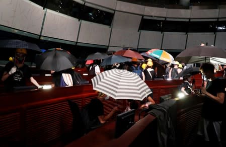 Protesters are seen inside a chamber after they broke into the Legislative Council building during the anniversary of Hong Kong's handover to China in Hong Kong