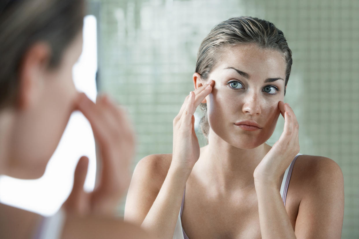 Woman Applying Facial Cream