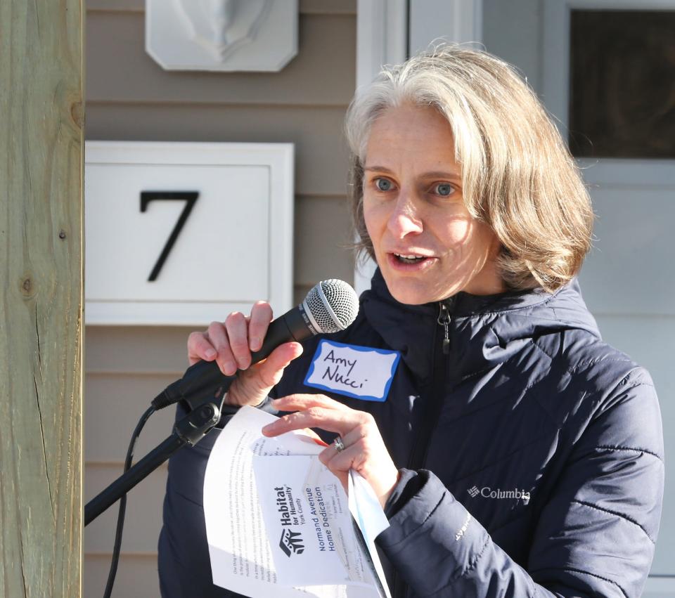 Amy Nucci, executive director of Habitat for Humanity York County, welcomes people to the Normand Avenue home dedication in Sanford Feb. 20, 2024.