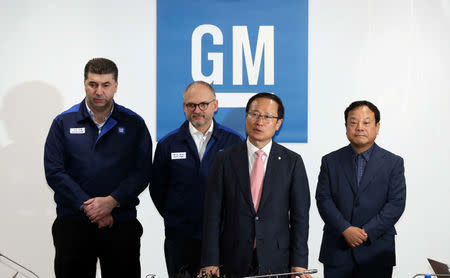 Kaher Kazem (L), chief executive of GM Korea, and Barry Engle (2nd L), head of GM's international operations, attend a news conference in Incheon, South Korea, April 23, 2018. Yonhap via REUTERS