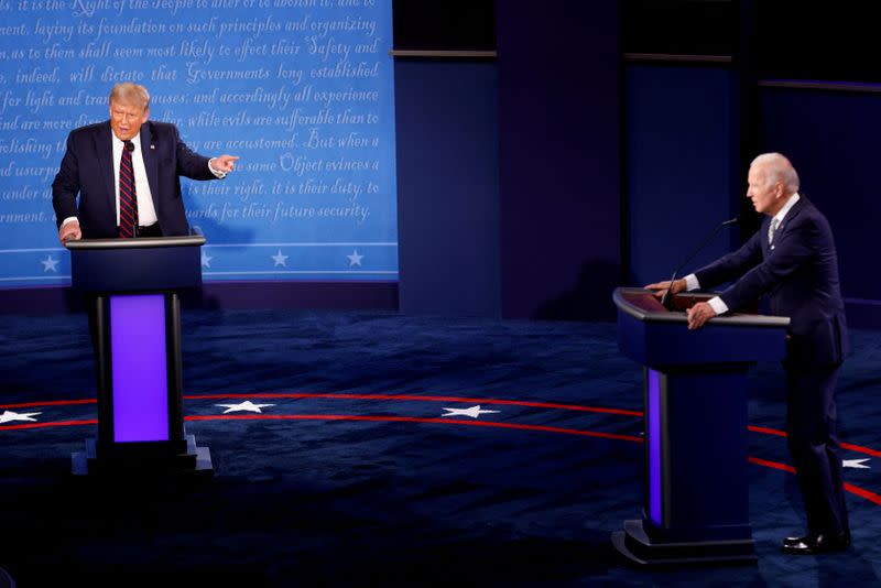 FILE PHOTO: U.S. President Donald Trump and Democratic presidential nominee Joe Biden participate in their first 2020 presidential campaign debate in Cleveland