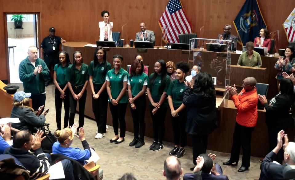 Members of the Detroit Cass Tech High School girls golf team are all smiles at receiving a standing ovation from a packed Coleman A. Young Municipal Center auditorium in downtown Detroit on Tuesday, November 7, 2023.