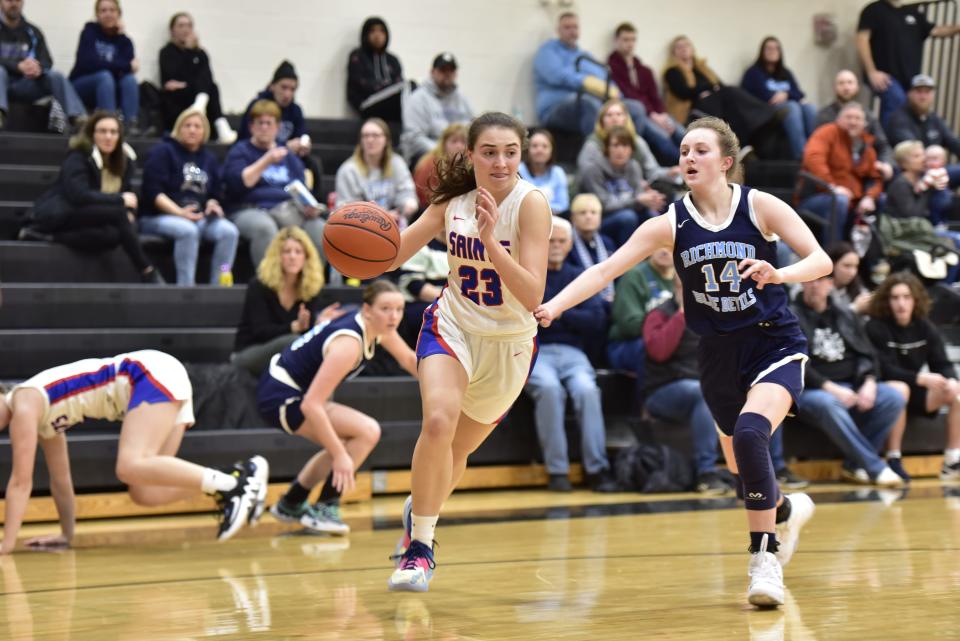 St. Clair's Allie Komarowski drives the lane during the Saints' 47-31 win over Richmond in a Division 2 district quarterfinal at Armada High School on Monday. She led all scorers with 16 points.