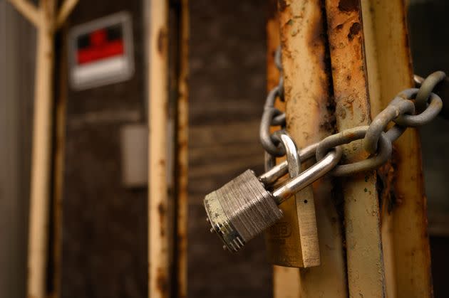 A padlock secures a door on a shuttered storefront in Braddock. (Photo: Justin Merriman for HuffPost)