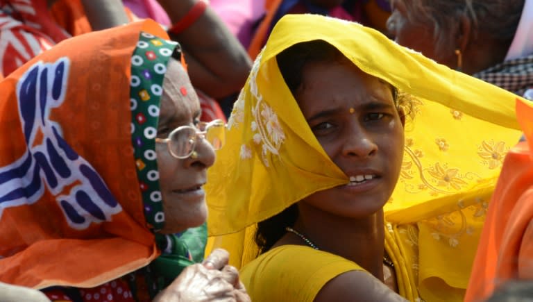 Women listen as Indian Prime Minister Narendra Modi speaks during an election rally in Aurangabad, Bihar state, on October 9, 2015