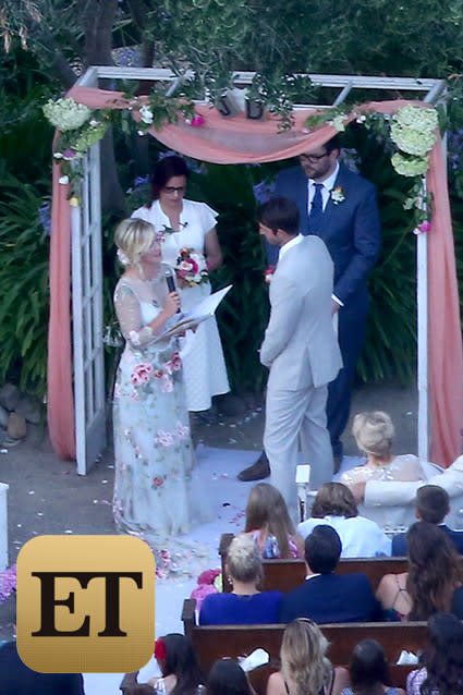 Who's got the tissues? There was hardly a dry eye on the ranch when Jennie Garth married actor-producer Dave Abrams at her farmhouse in Los Olivos, Calif., Saturday evening. <strong>NEWS: Jennie Garth Marries Dave Abrams</strong> The blushing bride, decked out in a floral-embroidered gown with a sheer long-sleeve overlay -- looked extremely happy but a little nervous as she walked down the aisle solo, a source tells ET. She had no reason to be concerned, though -- Abrams, looking sharp in a light gray suit, lit up as soon as he saw his bride-to-be in her wedding gown for the first time. FameFlynet FameFlynet Aw! Everything about the wedding was traditional and intimate, from the close friends and family in attendance at Garth's Santa Ynez Valley home to all three of Jennie's daughters -- Luca Bella, 17, Lola Ray, 12, and Fiona Eve, 8 -- looking on as her beautiful, excited bridesmaids. FameFlynet FameFlynet <strong>PHOTOS: Gorgeous Celeb Wedding Dresses </strong> The most poignant part of the wedding, however, was when it came time to exchange vows. Both bride and groom stood in front of a white archway framed by peach tulle and flowers and clutched folders as they shared their own "very emotional" vows, the source said. Garth even had to dry her eyes at one point during Abrams' speech. FameFlynet FameFlynet After Garth and Abrams were declared man and wife, all of the attendees jumped to their feet to congratulate the newly married couple. The doting duo gave the bridesmaids, who were sporting adorable floral headbands, big hugs, embracing them as they walked to an open area of the ranch to take official wedding photos. FameFlynet ETONLINE Guests were treated to a reception full of rustic elegance, with chic, simple white shades, lawn lamps and dividers framing the yard and white linens and plates placed on dark wooden picnic tables to add to the cozy feel. FameFlynet Romance stayed in the air (but how could it not?) as the couple stepped into the spotlight to dance to Elton John's "Your Song," which is about as sweet a song as one can pick. <strong>WATCH: Third Times the Charm for These 9 Lovesick Celebrities </strong> There was plenty of fun music for all of the attendees to dance to as well, with the party going strong to lovestruck tunes like The Eagles' "Best of My Love," The Four Tops' "Ain't No Woman (Like the One I've Got)," John Legend's "P.D.A. (We Just Don't Care)" and Michael Jackson's "Rock With You." Who were some of the fabulous attendees dancing the night away? They included Garth's BFFs, of course, like her <em>Beverly Hills, 90210</em> co-star Tori Spelling. While her husband Dean McDermott and fellow <em>90210</em> castmates weren't at the ranch, Spelling still had an amazing time celebrating Garth's nuptials alongside costume designer Erik Rudy and actor Miguel Pinzon. FameFlynet While he couldn't be in attendance, ET caught up with Ian Ziering at Comic-Con in San Diego on Saturday, and he shared his love and well wishes for his <em>90210</em> co-star on her special day. "Jennie is such a special person," he said. "She's so fantastic. I was hoping that she’d be able to find love again, and knowing her, I'm not surprised that it's happened." <strong>PHOTOS: Inside Vanessa Williams' Lavish Wedding </strong> Third time was definitely the charm for Garth, who was previously married to <em>Twilight</em> star Peter Facinelli -- with whom she has Luca, Lola and Fiona -- from 2001 to 2013 and Daniel Clark from 1994 to 1996. Garth and Abrams met on a blind date last fall and got engaged in April. There are even more big celeb weddings coming up this summer and fall -- find out which ones we're most excited for in the video below.