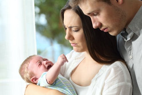 <span class="caption">Both parents can struggle with depression after the birth of their child.</span> <span class="attribution"><a class="link " href="https://www.shutterstock.com/image-photo/tired-desperate-parents-holding-their-baby-683174032" rel="nofollow noopener" target="_blank" data-ylk="slk:Antonio Guillem/ Shutterstock;elm:context_link;itc:0;sec:content-canvas">Antonio Guillem/ Shutterstock</a></span>