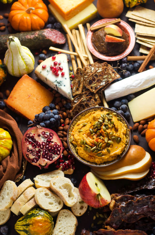 <p>Host the Toast</p><p>How to make the ultimate autumn harvest cheese board. Tips on selecting the best ingredients, plus recipes for smoky chipotle pumpkin hummus, candied bacon and bourbon apple butter!</p><p><strong>Get the recipe: <a href="https://hostthetoast.com/how-to-make-the-ultimate-autumn-harvest-cheese-board/" rel="nofollow noopener" target="_blank" data-ylk="slk:Ultimate Autumn Harvest Cheese Board;elm:context_link;itc:0;sec:content-canvas" class="link ">Ultimate Autumn Harvest Cheese Board</a></strong></p>