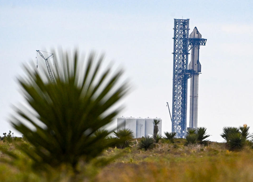 The SpaceX Starship spacecraft sits on a super Super Heavy rocket booster at the company's launch facility in south Texas on Feb. 10, 2022.