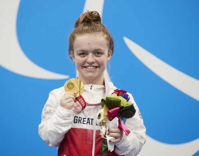 Great Britain&#x002019;s Maisie Summers-Newton celebrates with her gold medal at the Paralympic Games