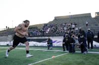 UW Whitewater lineman Quinn Meinerz runs at the school's pro football day Tuesday, March 9, 2021, in Whitewater, Wisc. The only FCS teams hosting pro days this year were Central Arkansas, North Dakota State and South Dakota State. Division III Wisconsin-Whitewater held one only because its Senior Bowl revelation, offensive lineman Quinn Meinerz, warranted another look after his team did not play in the fall. (AP Photo/Morry Gash)