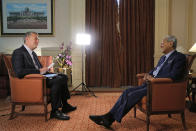 CORRECTS SPELLING OF PRIME MINISTER'S NAME - Malaysia's Prime Minister Mahathir Mohamad, right, listens to a question by The Associated Press Asia-Pacific News Director, Adam Schreck during an interview with The Associated Press in Putrajaya, Malaysia, Monday, Aug. 13, 2018. (AP Photo/Yam G-Jun)