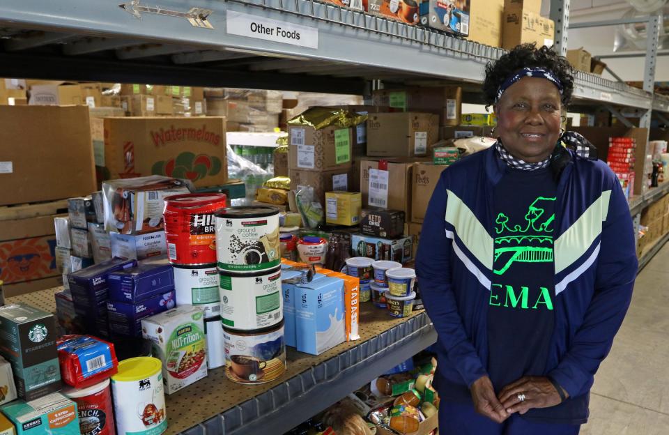 Francis Webber poses with some of the food items to be handed out for those in need Friday morning, May 20, 2022, at the Washington Outreach Ministry on Capernium Road near Cherryville.