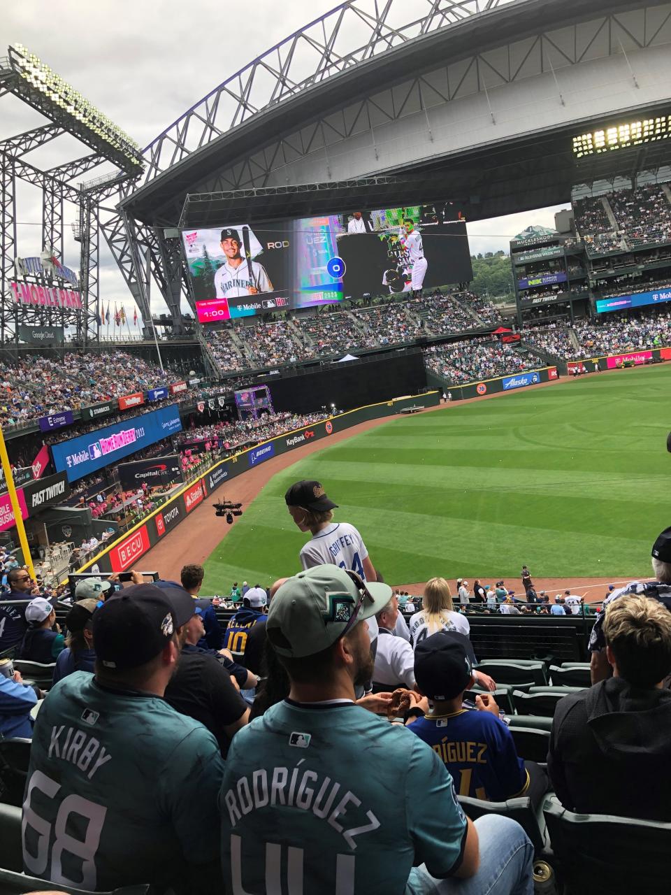 Mariners fans clad in George Kirby and Julio Rodriguez All-Star Game jerseys watch Rodriguez take batting practice Monday.