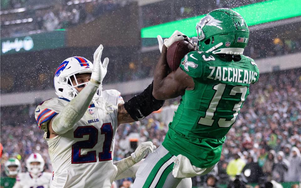 Nov 26, 2023; Philadelphia, Pennsylvania, USA; Philadelphia Eagles wide receiver Olamide Zaccheaus (13) makes a touchdown catch past Buffalo Bills safety Jordan Poyer (21) during the fourth quarter at Lincoln Financial Field. Mandatory Credit: Bill Streicher-USA TODAY Sports