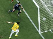 Brazil's Thiago Silva (L) scores a goal past Colombia's goalkeeper David Ospina during their 2014 World Cup quarter-finals at the Castelao arena in Fortaleza July 4, 2014. REUTERS/Fabrizio Bensch