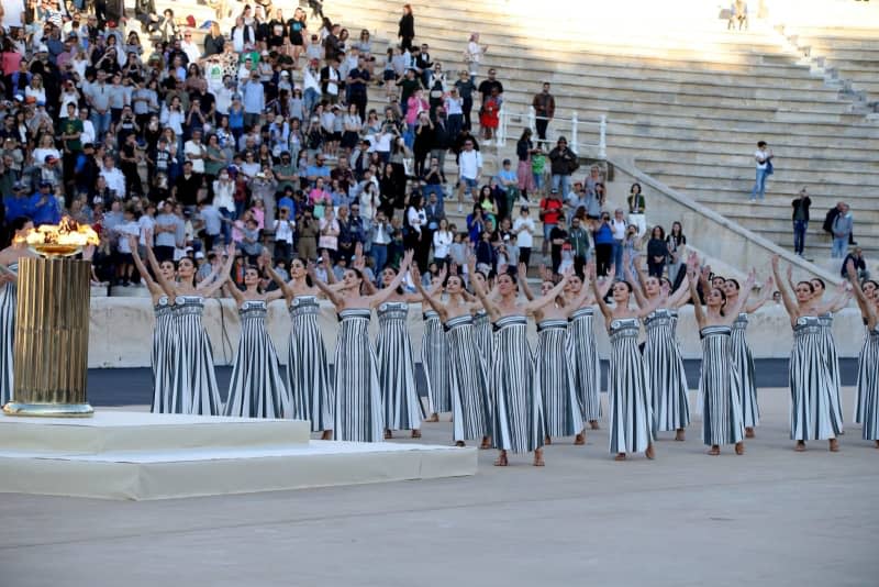 Greek actresses playing the role of priestesses perform during the Olympic Flame handover ceremony, at the Panathenaic Stadium in Athens. Aristidis Vafeiadakis/ZUMA Press Wire/dpa