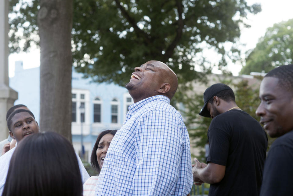 Dontae Sharpe breathes the air outside the Pitt County Courthouse after a judge determined he could be set free, Thursday, Aug. 22, 2019 in Greenville, N.C. Sharpe, a North Carolina man who maintained his innocence even as he served a life sentence for a murder he didn’t commit said Thursday that he got his strength in prison from God and his mother. (Deborah Griffin/The Daily Reflector via AP)