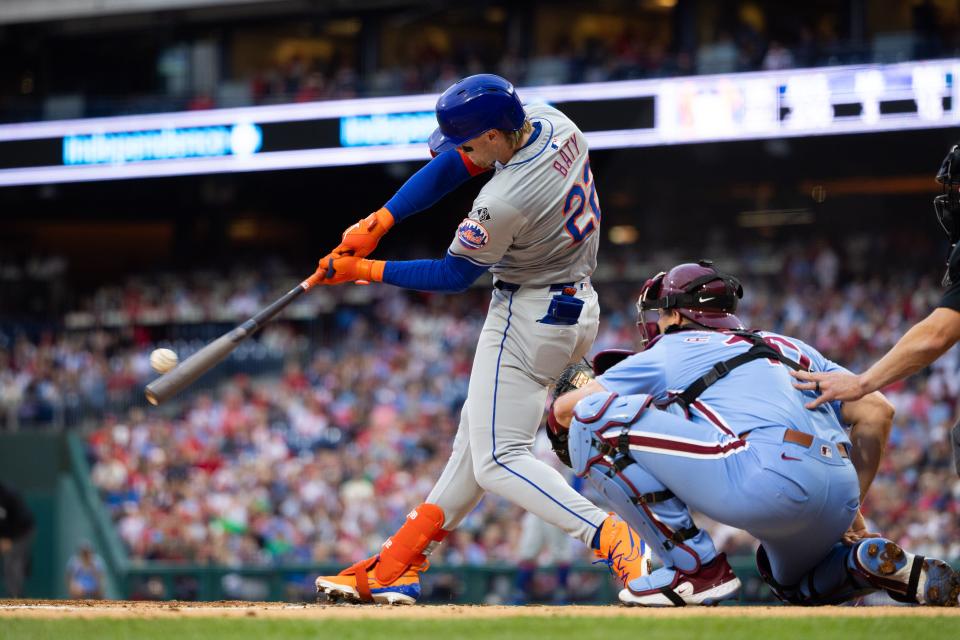 New York Mets third baseman Brett Baty (22) hits an RBI double during the second inning against the Philadelphia Phillies on May 16, 2024, at Citizens Bank Park.