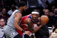 Brooklyn Nets' Bruce Brown (1) defends against Washington Wizards' Bradley Beal, right, during the first half of an NBA basketball game Monday, Oct. 25, 2021, in New York. (AP Photo/Frank Franklin II)