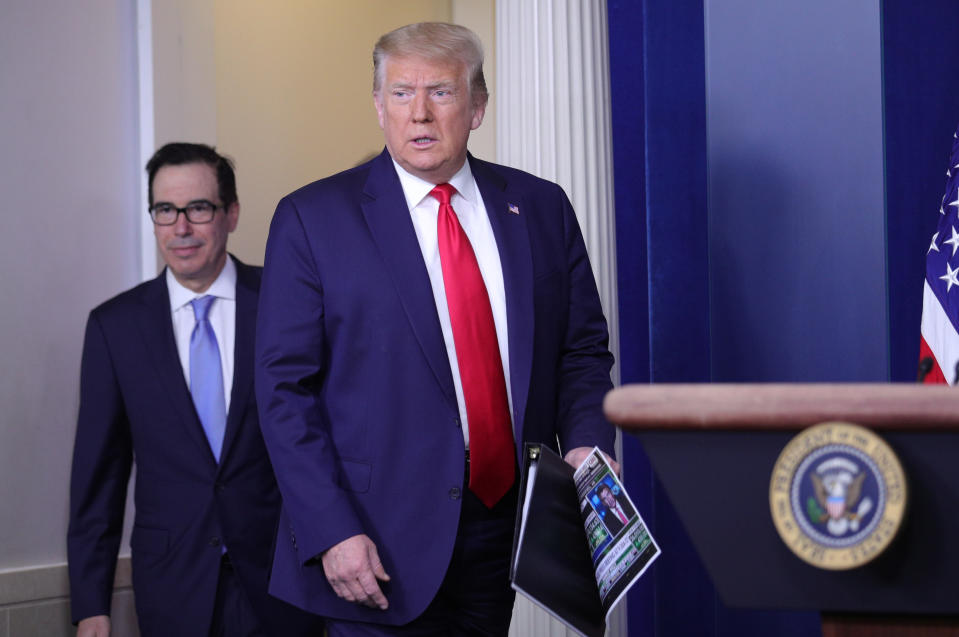 President Donald Trump arrives with Treasury Secretary Steven Mnuchin to address a press briefing on the U.S. economy on July 2, 2020.  (Tom Brenner/Reuters)