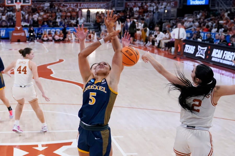 Drexel forward Chloe Hodges (5) is blocked by Texas guard Shaylee Gonzales (2) as she tries to score during the second half of a first-round college basketball game in the women’s NCAA Tournament in Austin, Texas, Friday, March 22, 2024. (AP Photo/Eric Gay)